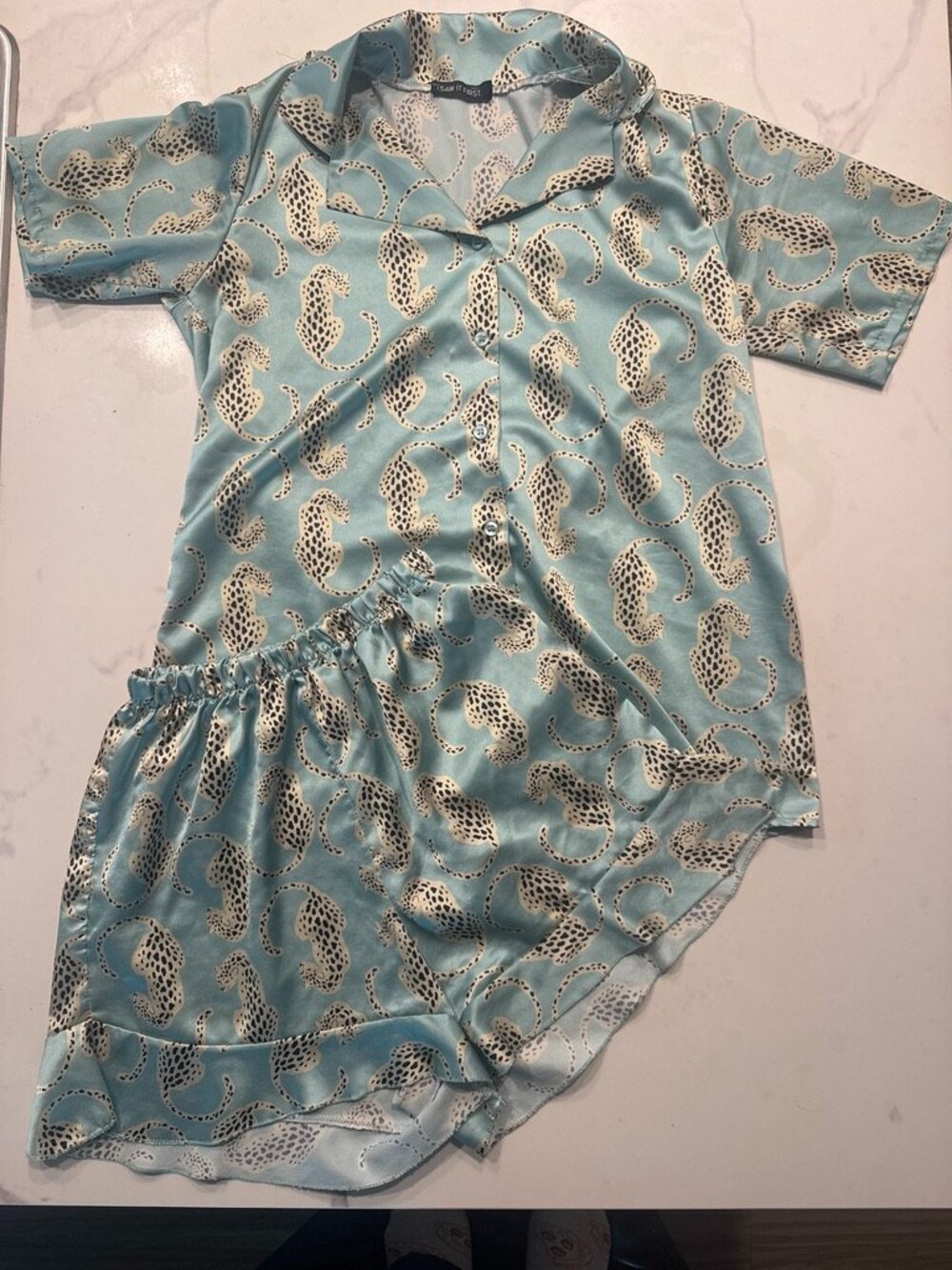 Blue satin pajama set with gold leopard print
